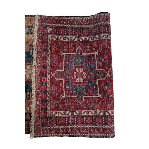 349 - A PERSIAN RUNNER 20th century, with central alternating geometric medallions, on a brick red ground,... 