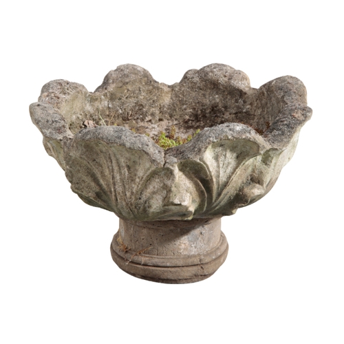 4 - TWO RECONSTITUTED STONE PLANTERS one with a leaf formed bowl on an associated turned socle, 35cm hig... 