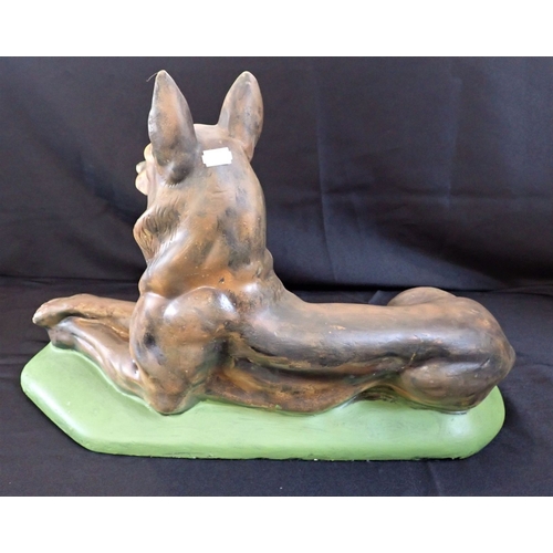 144 - A LARGE PAINTED PLASTER MODEL OF AN ALSATION DOG 56cm long