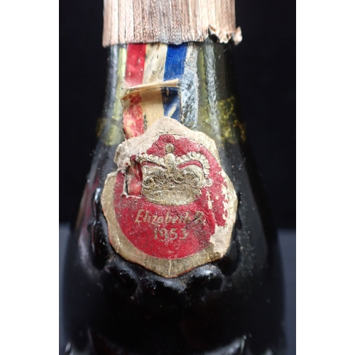 251 - A 1953 CORONATION SOUVENIR BOTTLE OF GUINNESS the bottle moulded with the Lion and Unicorn (with con... 