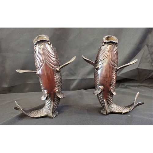 379 - A NEAR PAIR OF JAPANESE BRONZE CARP standing on their tails, mouths open 22cm and 23cm high