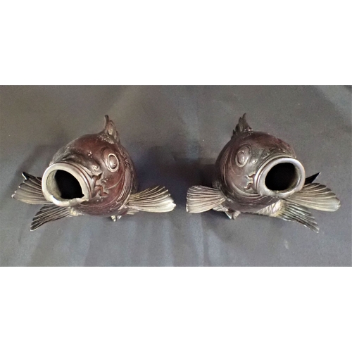 379 - A NEAR PAIR OF JAPANESE BRONZE CARP standing on their tails, mouths open 22cm and 23cm high