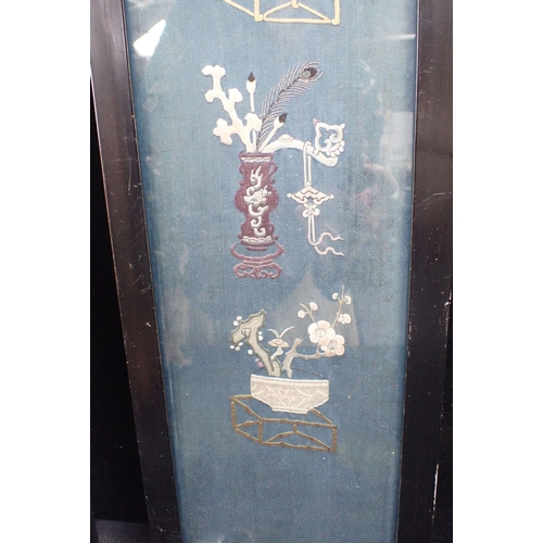 381 - A PAIR OF CHINESE EMBROIDERED BLUE SILK PANELS in ebonised frames 94.5 x 19cm