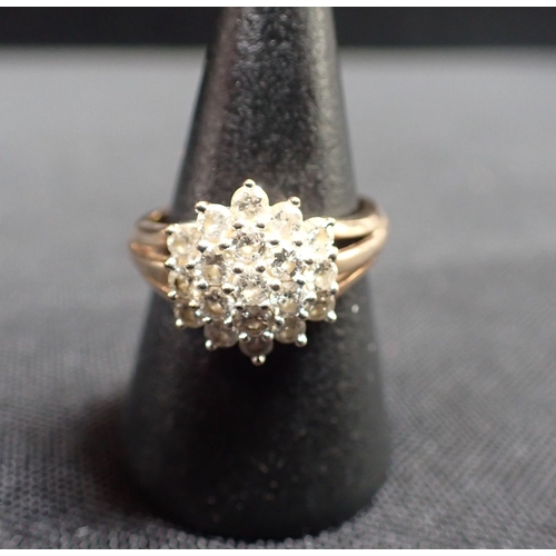 424 - A DIAMOND CLUSTER RING (c. 1ct) total weight on an unmarked yellow gold shank with open work shoulde... 