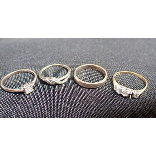 426 - A COLLECTION OF RINGS (4) three diamond rings and one unmarked wedding band