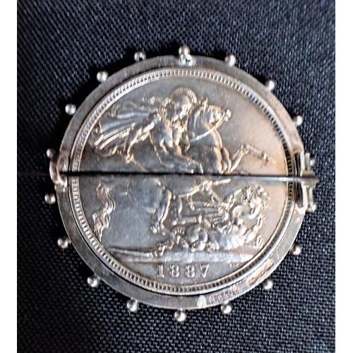 438 - AN 1887 VICTORIA CROWN COIN BROOCH with swivel fitting, in hallmarked silver mount