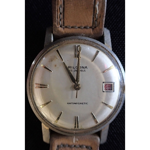 477 - A GENTS RILCONA WRISTWATCH with brown leather strap and two other vintage wristwatches, contained in... 