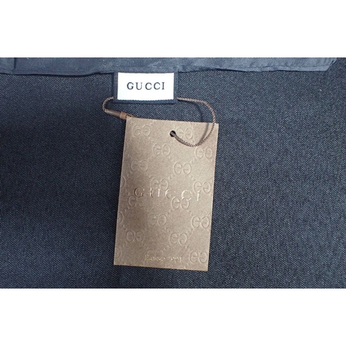 493 - A GUCCI HEADSCARF, WITH ROSE DESIGN and GUCCI motif, with tag