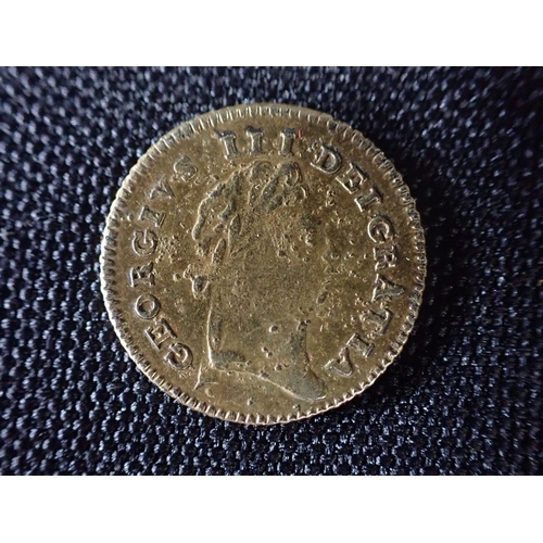 504 - A COUNTERFEIT THIRD GUINEA, OR SEVEN SHILLING PIECE possibly a game token, dated 1801 (bobbly surfac... 