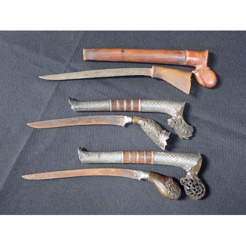 516 - TWO SIMILAR INDONESIAN SEWAR DAGGERS, MALAY OR SUMATRA with carved horn handles and white metal moun... 