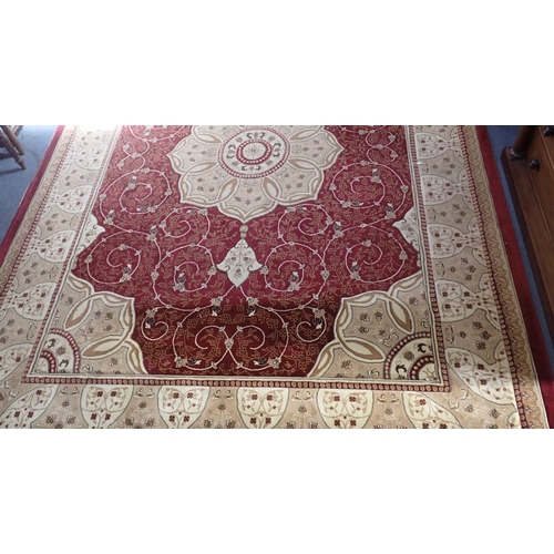 712 - A LARGE MACHINE-MADE PERSIAN STYLE CARPET with cream rose medallion 280 x 382cm (some wear to edge s... 