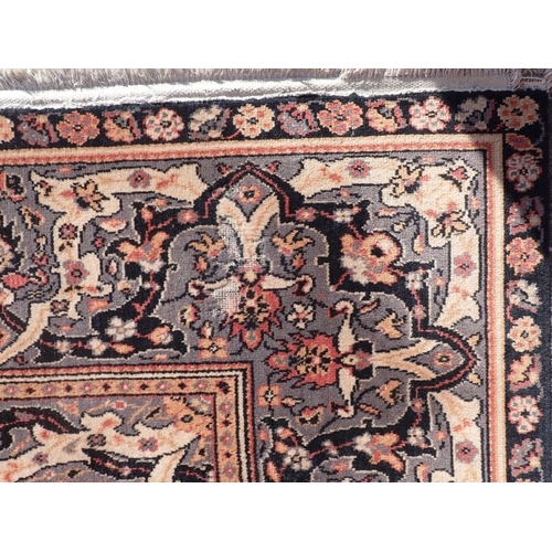 716 - A PERSIAN DESIGN RUG 200 x 270cm (unevenly faded, moth damage, cut)