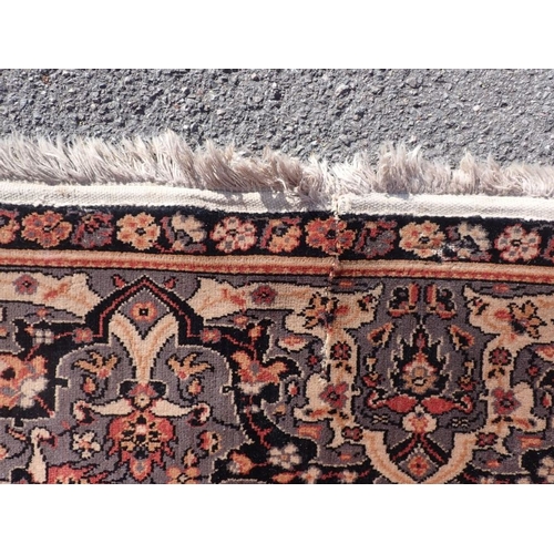 716 - A PERSIAN DESIGN RUG 200 x 270cm (unevenly faded, moth damage, cut)