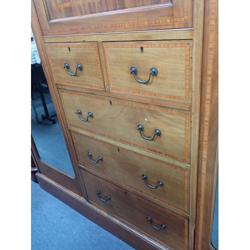 745 - AN EDWARDIAN MAHOGANY TRIPLE WARDROBE with satinwood crossbanding and mirrored doors 191cm wide (at ... 