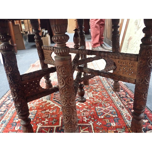 802 - AN INDIAN BRASS-TOPPED TABLE with folding base