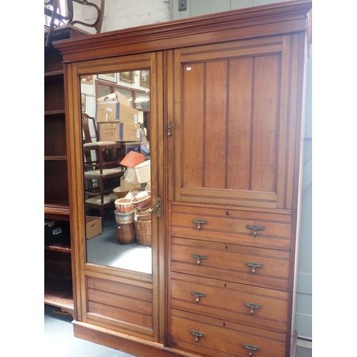 810 - A LATE VICTORIAN COMPACTUM WARDROBE with incised line decoration and brass handles 157cm wide