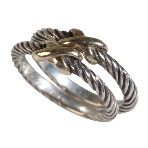 10 - DAVID YURMAN: A PAIR OF SILVER AND 14K GOLD MOUNTED CABLE TWIST BANDS ring size L, in a Bloomingdale... 