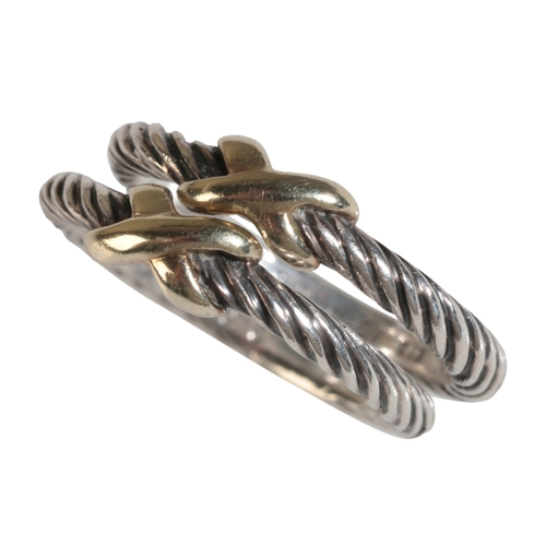 10 - DAVID YURMAN: A PAIR OF SILVER AND 14K GOLD MOUNTED CABLE TWIST BANDS ring size L, in a Bloomingdale... 