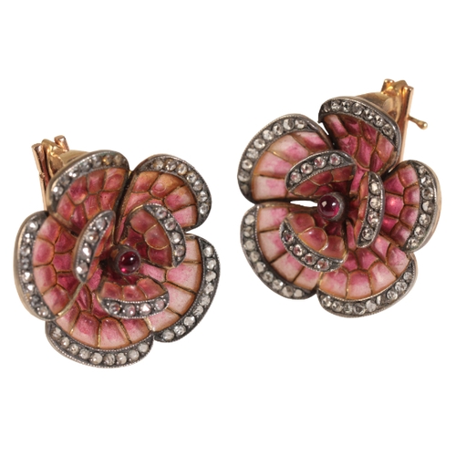 24 - A PAIR OF FLORAL EARRINGS with old cut diamonds bordering each petal, surrounding a centre red caboc... 