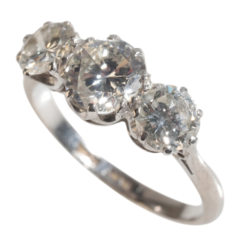 28 - A THREE STONE DIAMOND RING the central brilliant-cut diamond (c.1.25ct) flanked to either side with ... 
