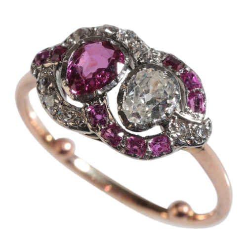 32 - AN EDWARDIAN RUBY AND DIAMOND RING to an unmarked yellow metal shank, with arthritic balls, ring siz... 