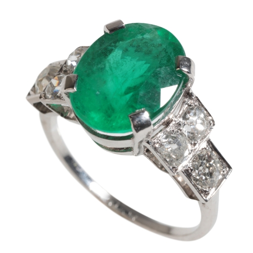 39 - A PLATINUM, EMERALD AND DIAMOND RING the oval emerald approx. 3ct, set with six diamonds to shank ea... 