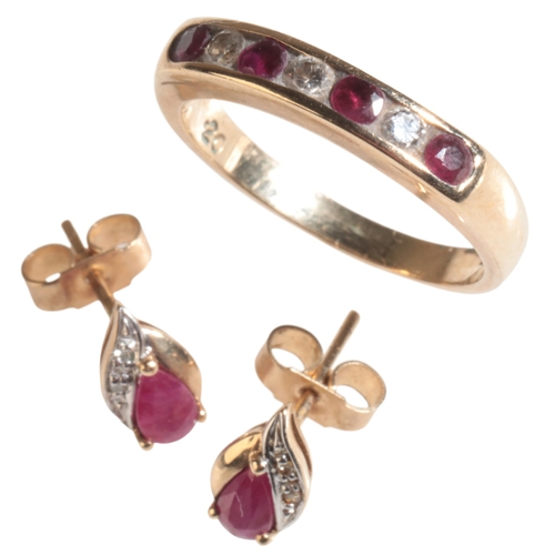 49 - A 9CT GOLD RUBY AND DIAMOND RING channel set with seven alternating stones, comprising four rubies a... 