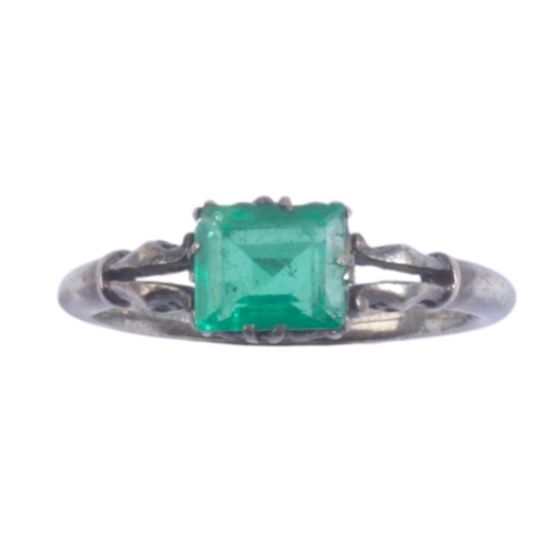 52 - AN EMERALD AND DIAMOND RING the central emerald set with a c. 5pt mine cut diamond either side separ... 