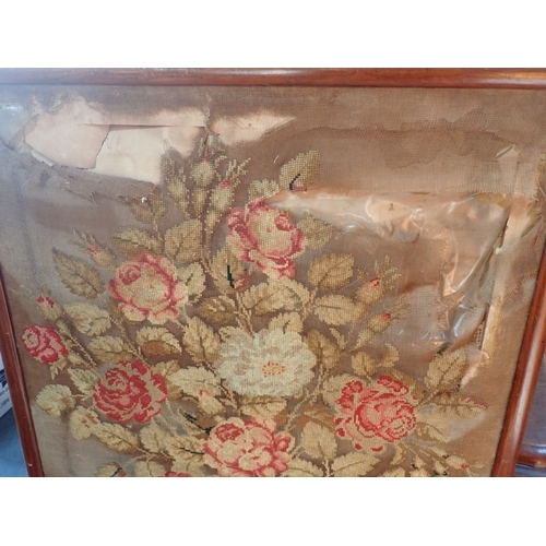 116 - A VICTORIAN WOOL WORK FIRESCREEN (poor condition) with other textile pieces