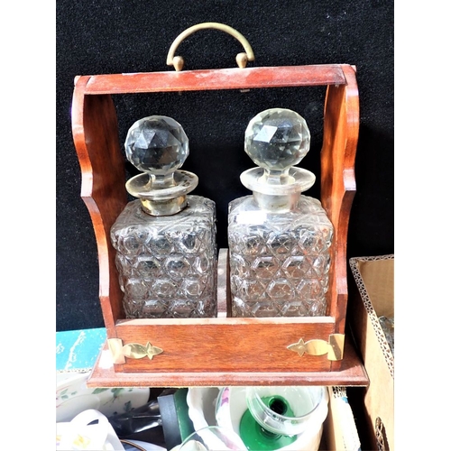 128 - A MODERN MAHOGANY BETJEMANN STYLE TWO DIVISION TANTALUS containing two cut-glass decanters, together... 