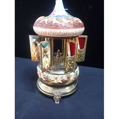 156 - AN ITALIAN KITSCH CIGARETTE DISPENSER, WITH NAPLES STYLE CERAMIC BODY in brass frame, clockwork acti... 