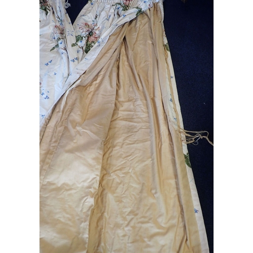 173 - A PAIR OF COUNTRY HOUSE CHINTZ CURTAINS lined and interlined with pencil pleats, some damage to lini... 