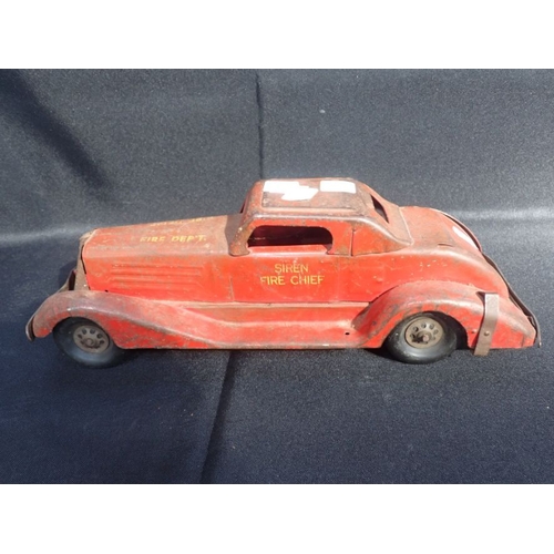 187 - AN EARLY 20TH CENTURY RED PAINTED METAL FIRE CAR stencilled 'Siren Fire Chief', the mechanism with b... 