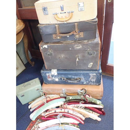 24a - A COLLECTION OF VINTAGE LUGGAGE and vintage fabric-covered coat hangers