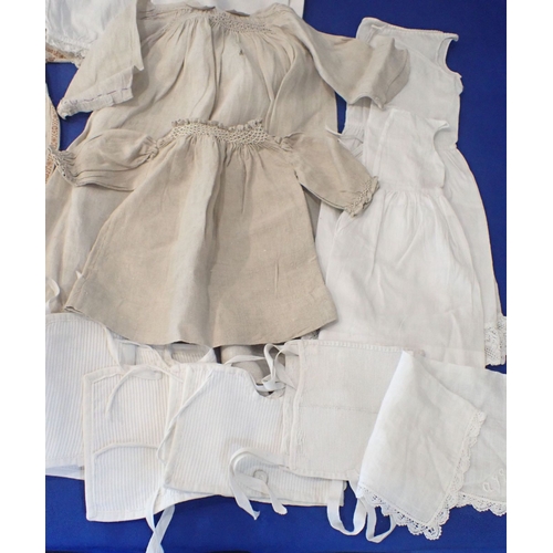 253 - A QUANTITY OF 19TH CENTURY DOLLS CLOTHES lovely hand made dolls/baby clothes dating from mid 19th ce... 