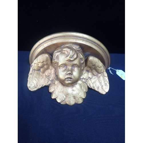 33 - A GILTWOOD AND PLASTER PUTTO WALL BRACKET 31cm wide (minor chips)