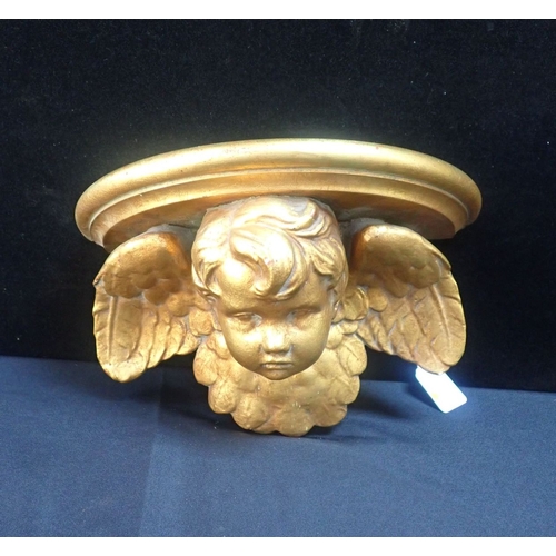 33 - A GILTWOOD AND PLASTER PUTTO WALL BRACKET 31cm wide (minor chips)