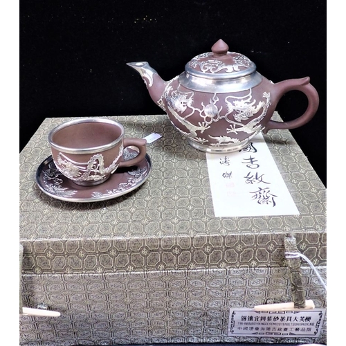 352 - A CHINESE YIXING AND WHITE METAL TEA SET the teapot decorated with dragons chasing flaming pearls, w... 