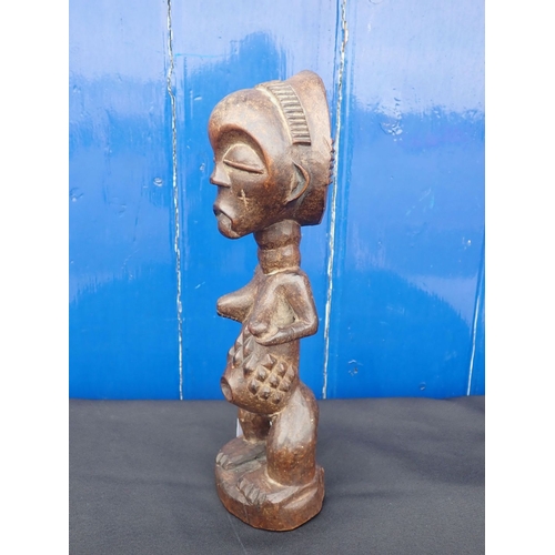 358 - A CARVED WOODEN FIGURE