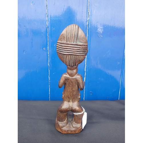 358 - A CARVED WOODEN FIGURE