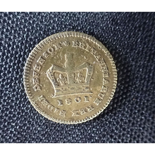 447 - A COUNTERFEIT THIRD GUINEA, OR SEVEN SHILLING PIECE possibly a game token, dated 1801 (bobbly surfac... 