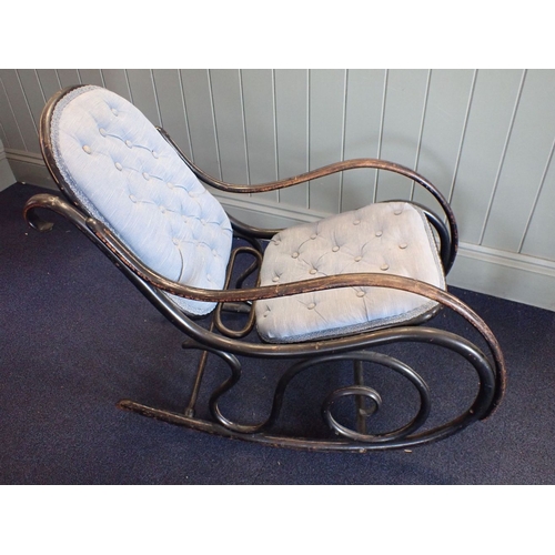 678 - A THONET ROCKING CHAIR, EBONISED with incised line decoration, and upholstered seat and back, stampe... 