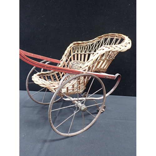 149 - A VICTORIAN DOLL'S PUSHCHAIR, WITH WICKER BODY and painted frame, retailed by Henry's 'Civet Cat' Ba... 