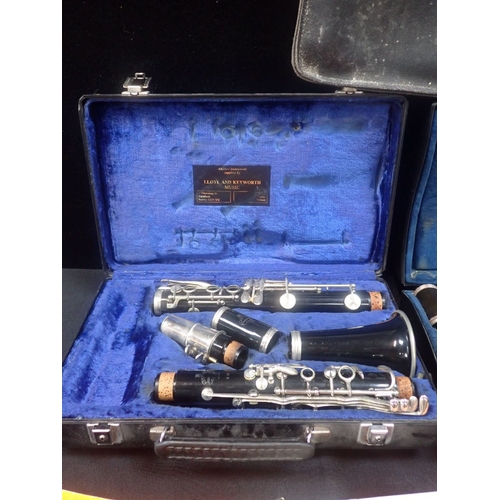 184 - A B12 BUFFET CLARINET with another, a music case and some sheet music