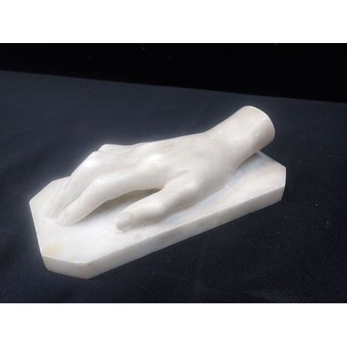 208 - A 19TH CENTURY CARVED MARBLE HAND on integral plinth, 18.5cm long, inscribed beneath 'Sofia Rouiba +... 