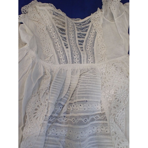 224 - A LACE AND EMBROIDERED CHRISTENING GOWN mid 19th century, together with two others (some staining) P... 