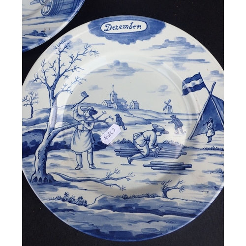 268 - A SET OF TWELVE DELFTS BLUE AND WHITE POTTERY CALENDAR PLATES made in Holland for the Metropolitan M... 