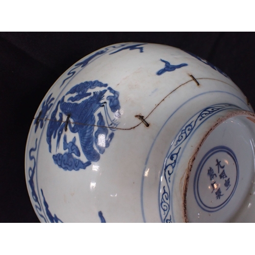 275 - A 19TH CENTURY CHINESE BOWL decorated with cranes and objects, within lines, in underglaze blue 27cm... 