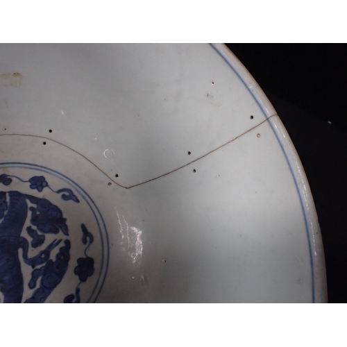 275 - A 19TH CENTURY CHINESE BOWL decorated with cranes and objects, within lines, in underglaze blue 27cm... 