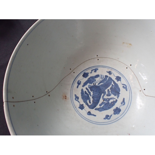 275 - A 19TH CENTURY CHINESE BOWL decorated with cranes and objects, within lines, in underglaze blue 27cm... 